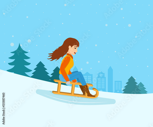 Young girl rolled down from mountain slope on a sled