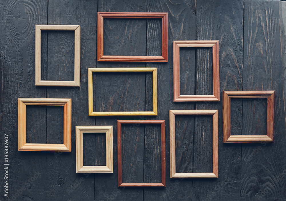 old frames on wooden wall old frames on wooden wall