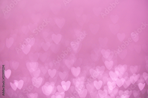 defocused lights bokeh background of pink hearts