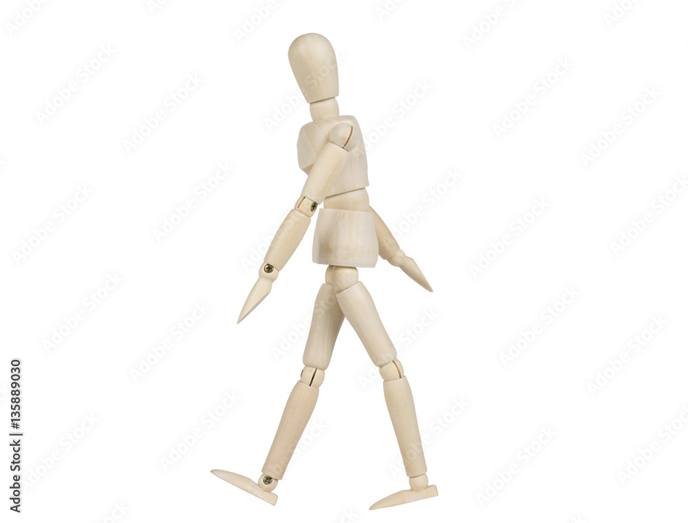 Wooden model thinking while walking isolated on a white background. Wooden model thinking while walking isolated on a white background.