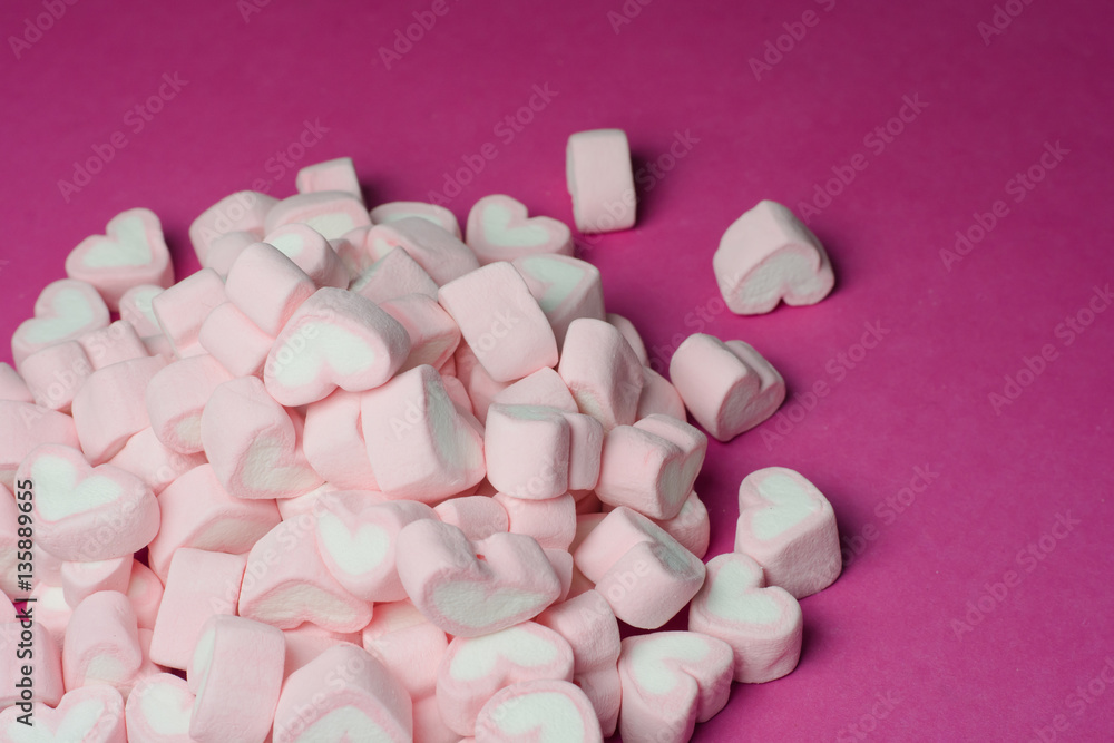 Pink heart shaped marshmallows background