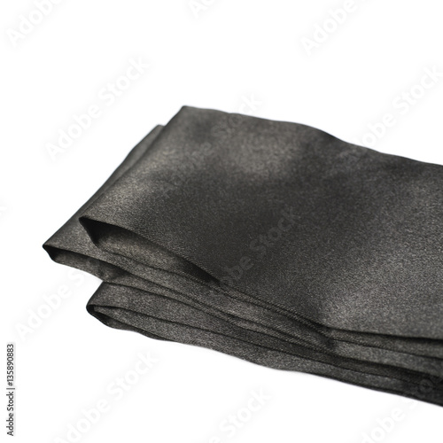 Folded strip of satin fabric isolated