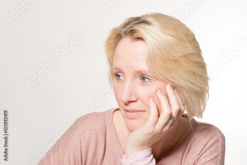 Lady Looking Away with Chin Resting on Hand