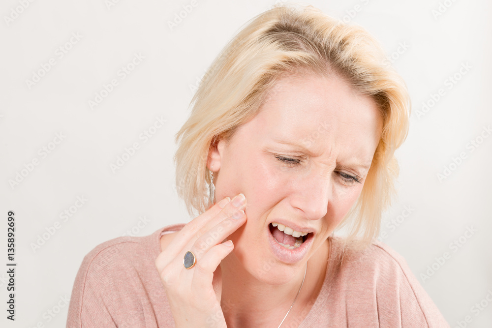 Lady with Toothache in Pain and Touching Right Cheek Lady with Toothache in Pain and Touching Right Cheek