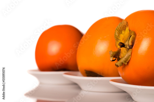 Persimmon fruit isolated on white background.