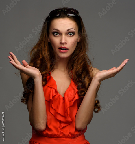 surprised beaudiful woman with long curly hair