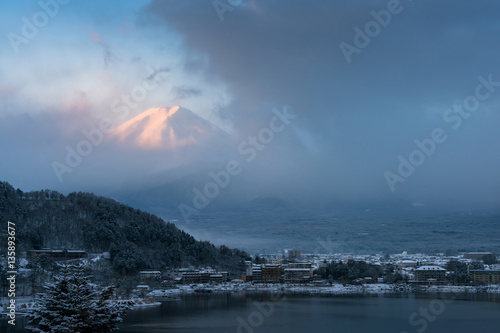Mountain Fuji and Kawaguchiko lake with morning mist in winter