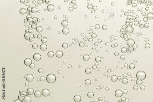 Beautiful light air bubbles flows over a blurred background