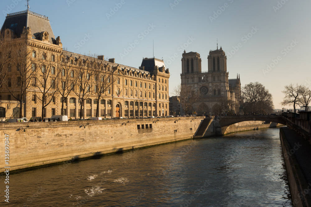 Bridges on the Seine river and passenger ships as a public transport vehicle in Paris.