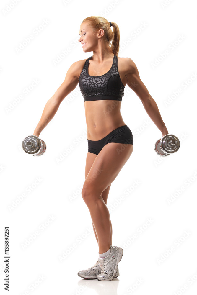 Beautiful fitness model with dumbbells Beautiful fitness model with dumbbells