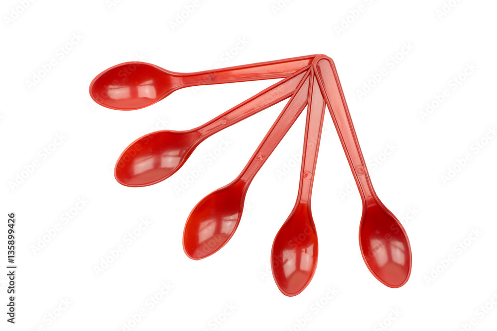 Red plastic spoon isolated on white background Red plastic spoon isolated on white background