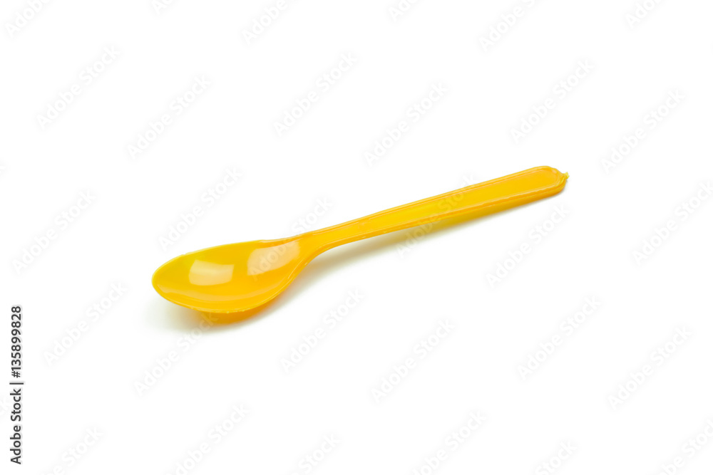 Orange plastic spoon isolated on white background Orange plastic spoon isolated on white background