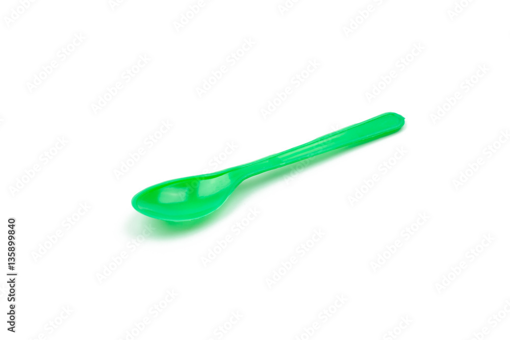 Green plastic spoon isolated on white background Green plastic spoon isolated on white background