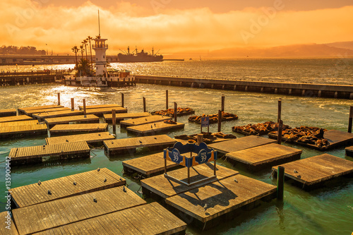 Spectacular landscape at sunset of Pier 39, San Francisco, California, United States.Pier 39, located at Fisherman's Wharf, is a popular tourist attraction for Sea Lions colony.Travel holidays concept photo