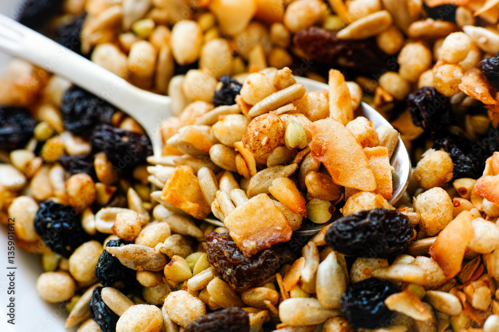 Gluten free muesli blend in plate with spoon Gluten free muesli blend in plate with spoon