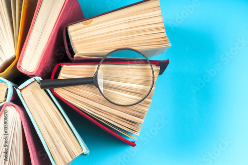 Top view of bright colorful hardback books in a circle.