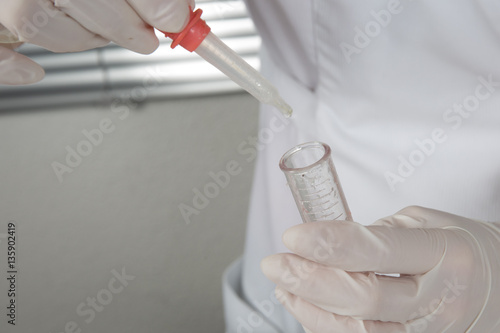 scientific doctor conducts experiments with a test tube