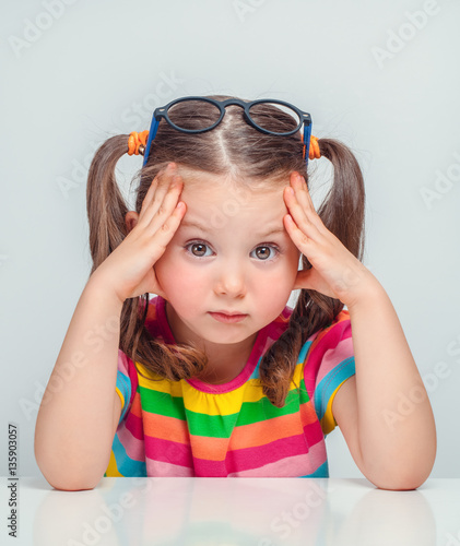 Quadro su tela beautiful cute little girl sulking and thinking