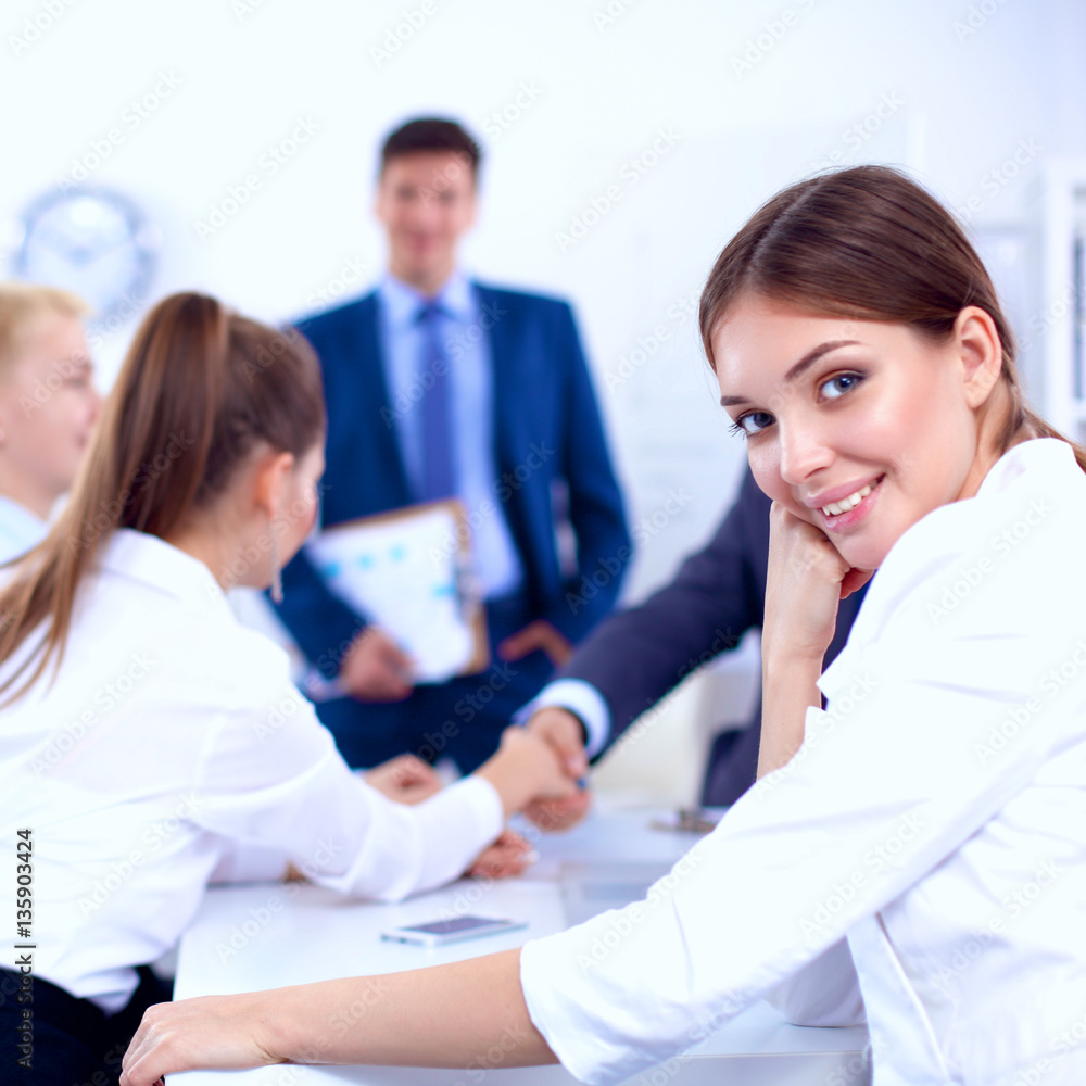 Business people sitting and discussing at business meeting Business people sitting and discussing at business meeting