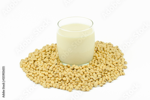 Milk with soy beans on white background.