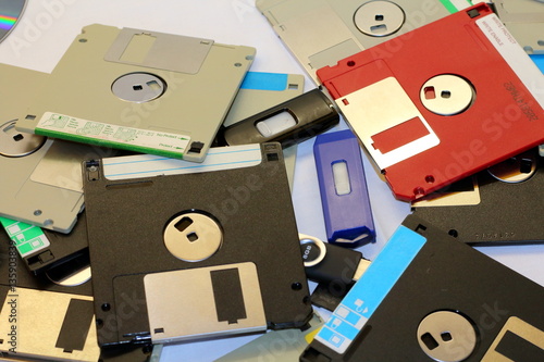 Computer floppy disk closeup on white, in a pyramid