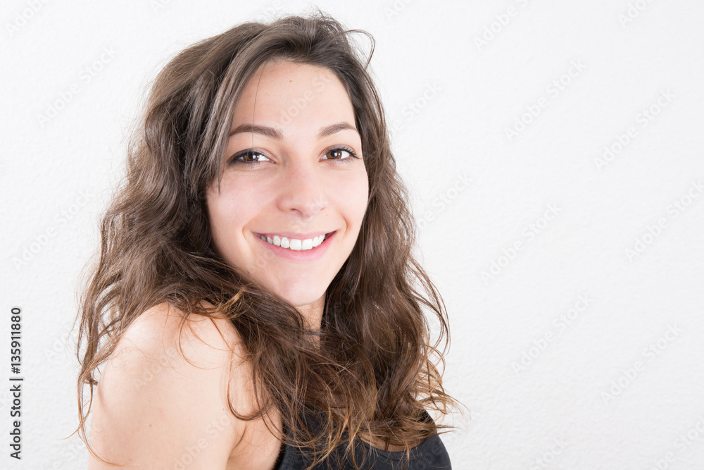 Young beautiful woman smiling with curly hair Young beautiful woman smiling with curly hair