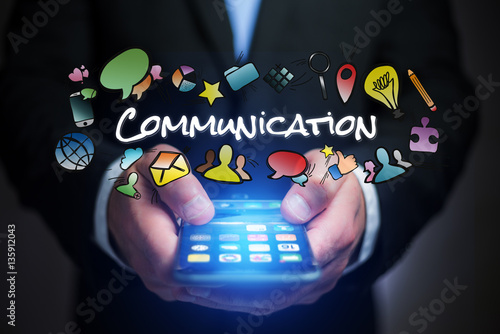 Concept of man holding smartphone with communication title and m