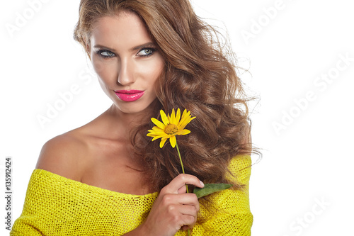 Portrait of young beautiful woman with stylish make-up and sunfl photo