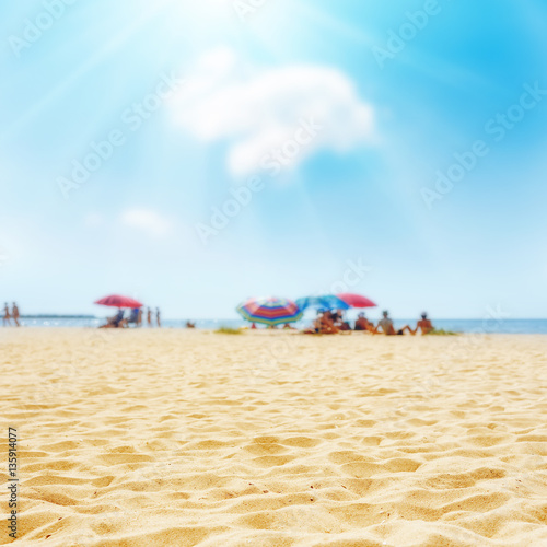 sand on the beach and sun in blue sky © Mykola Mazuryk