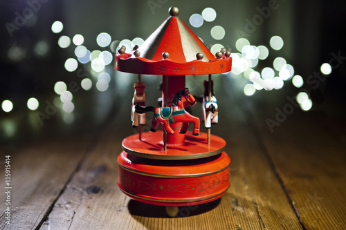 Red carousel toy with blur lights