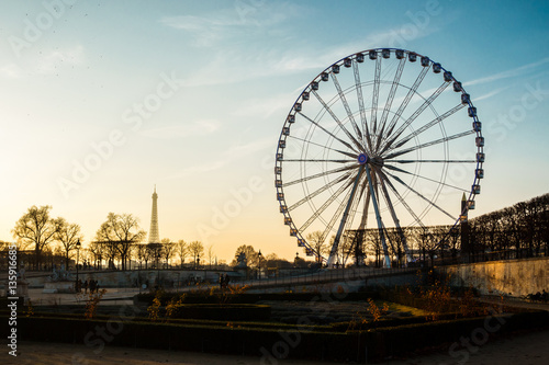 The ferris wheel and the Eiffel Tower in Paris, France