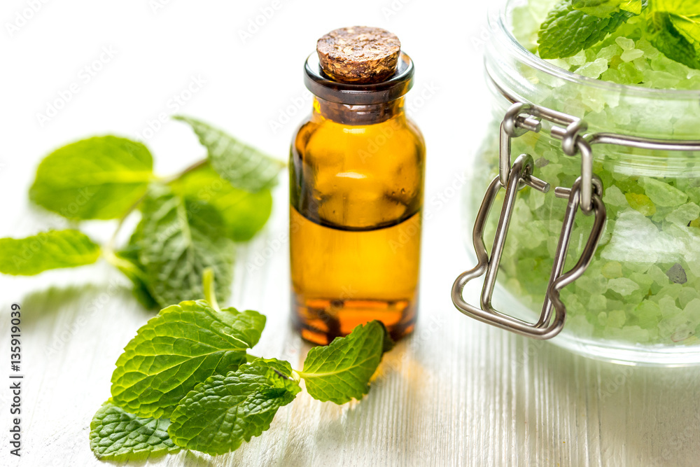 organic cosmetics with herbal extracts of mint on wooden background organic cosmetics with herbal extracts of mint on wooden background