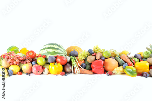 Fototapeta Naklejka Na Ścianę i Meble -  Ripe and tasty fruits and vegetables on a white background