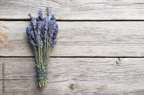 Fototapeta Naklejka Na Ścianę i Meble -  Bunch of lavender flowers on grey wooden background