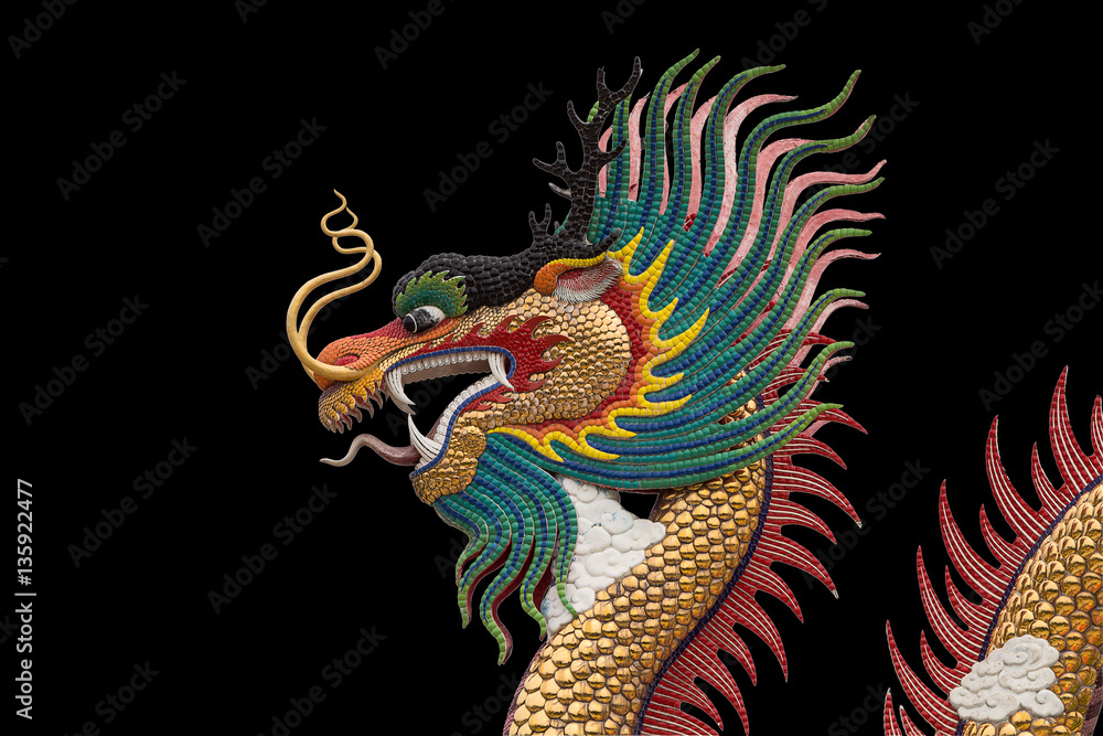 Colorful dragon statue isolated on black background