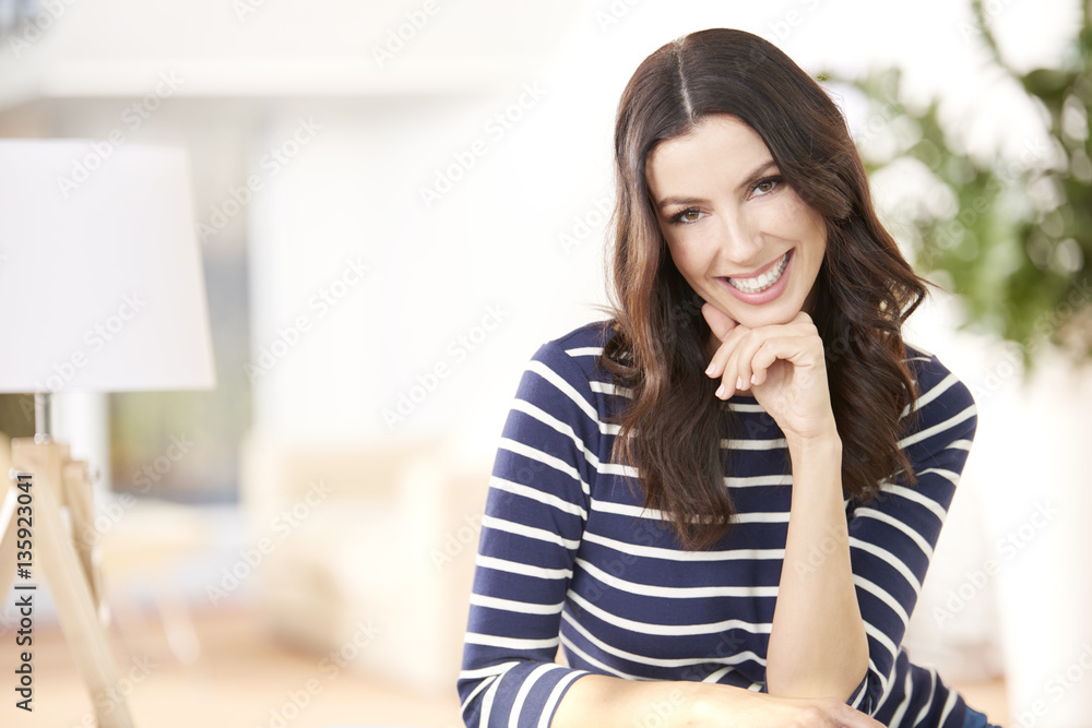Lovely young woman relaxing on couch at home Lovely young woman relaxing on couch at home