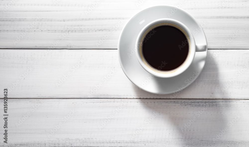 Hot cup of Americano coffee morning breakfast on white wooden ba Hot cup of Americano coffee morning breakfast on white wooden ba
