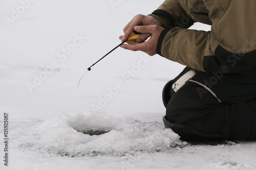 Fishing in the winter on the lake