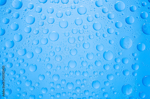 Fototapeta Naklejka Na Ścianę i Meble -  Water drops on blue background