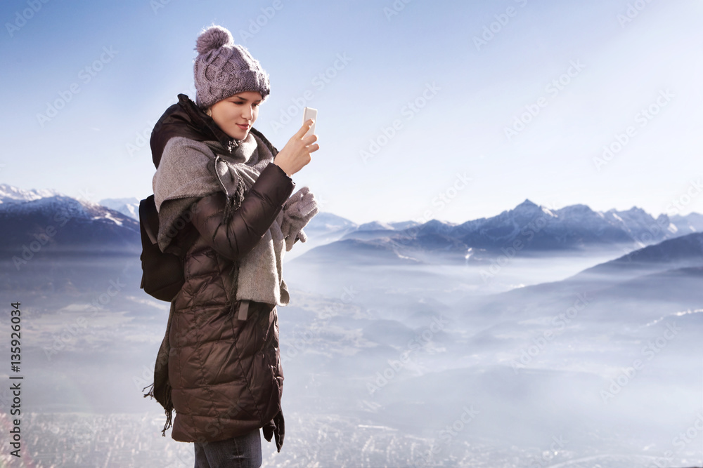 Young woman hiker taking photo with smart phone Young woman hiker taking photo with smart phone