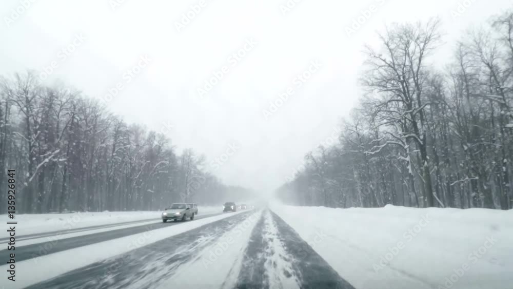 Driving POV on snowy country road. Winter Snow Mountain Road Driving. Forest. Driving Driving POV on snowy country road. Winter Snow Mountain Road Driving. Forest. Driving