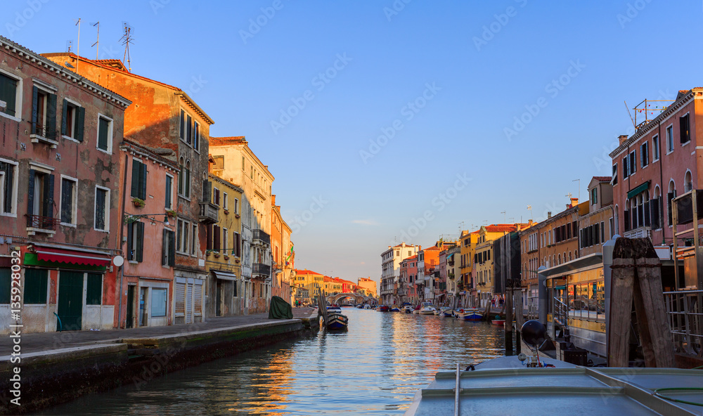 Venice, Italy - September 2, 2016. Morning in Venice reflected in canal waters