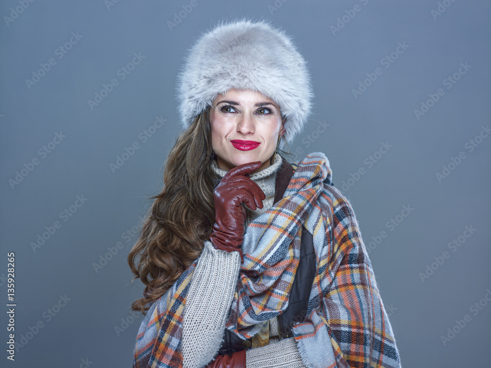 pensive modern woman isolated on cold blue looking on copy space pensive modern woman isolated on cold blue looking on copy space