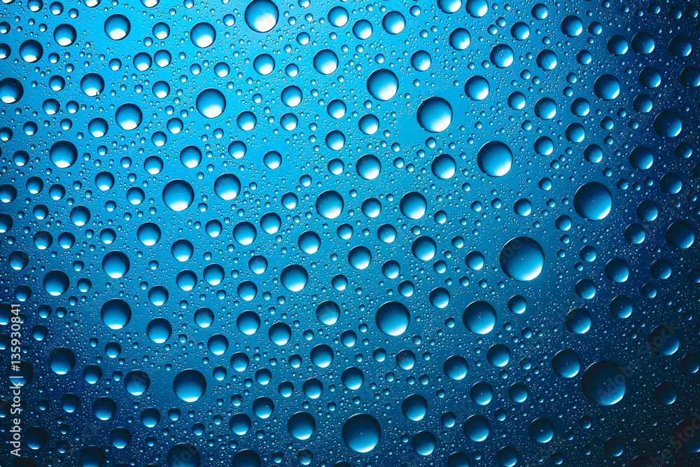 Water drops on blue glass surface texture. Water drops on blue glass surface texture.