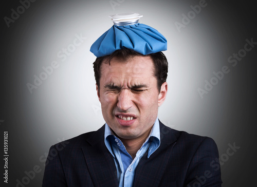 Εκτύπωση καμβά Office worker with an ice pack on his head
