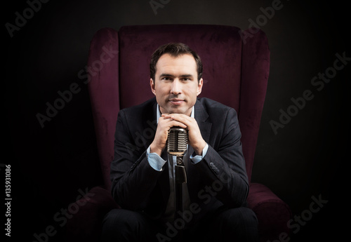 Radio presenter with a microphone photo