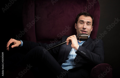 Fotografie Radio presenter with a microphone