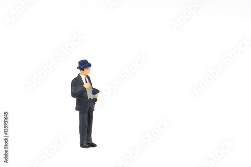 Miniature people business traveler on background with space for text © pigprox
