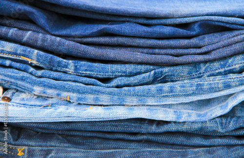 Stack of blue jeans close-up