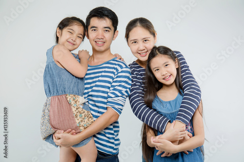 Happy Asian family smiling on isolated background, Happy family enjoying together